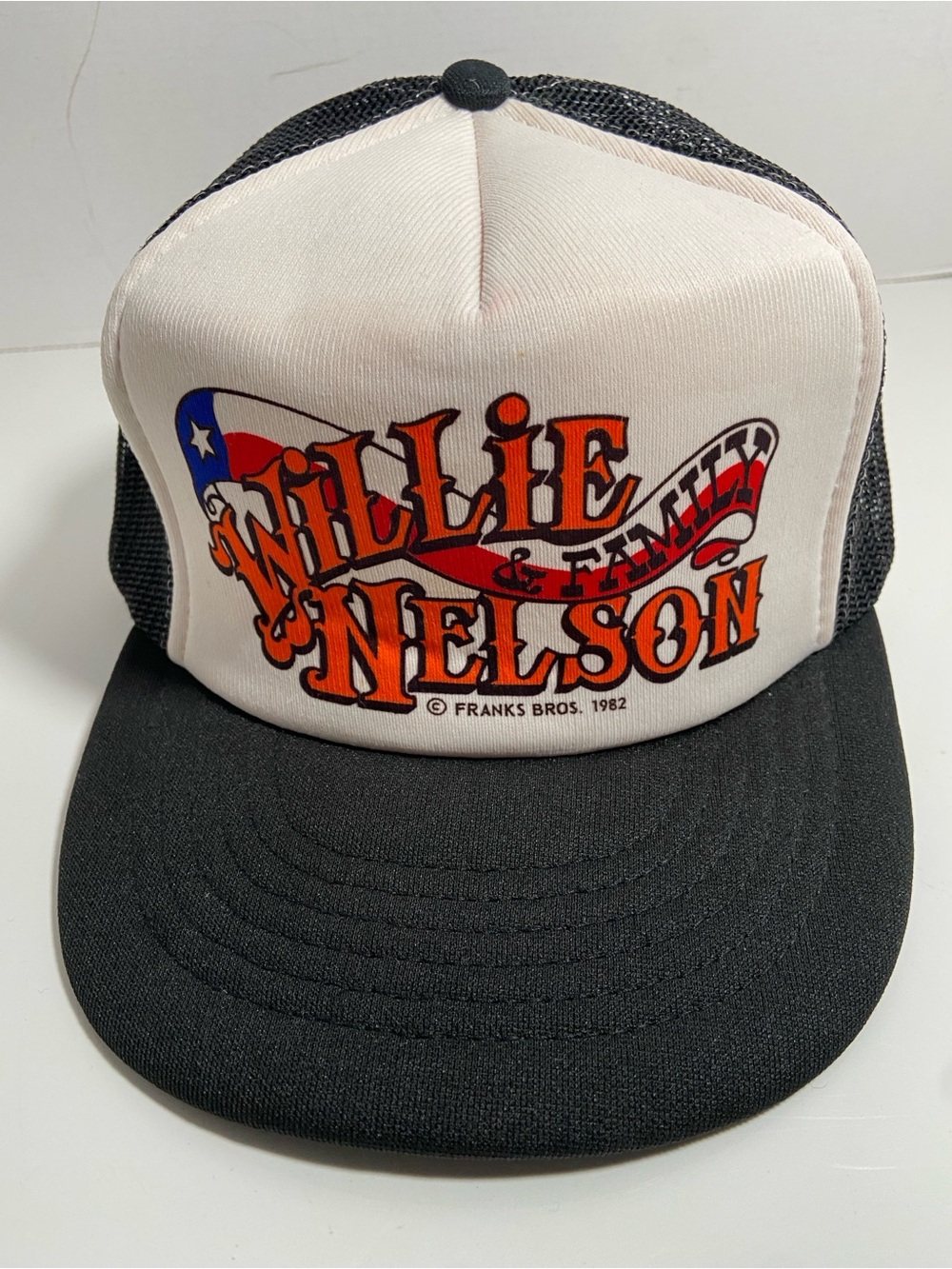 Vintage 1982 Willie Nelson & Family trucker hat with a snapback closure.